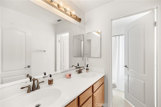 29778 Salmon St, Menifee, CA 92584 - bathroom with double vanity, toilet, and a shower with shower curtain