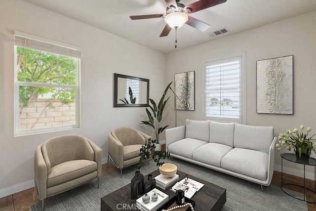 25863 Prospector Ct, Menifee, CA 92584 - living room featuring baseboards, healthy amount of natural light, and ceiling fan