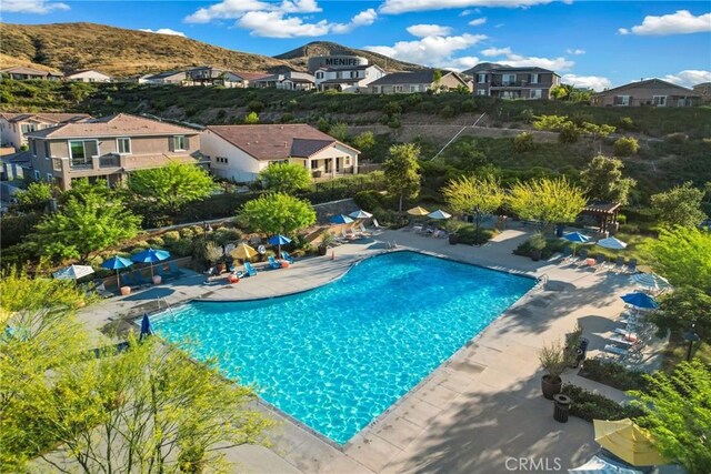 25863 Prospector Ct, Menifee, CA 92584 - swimming pool featuring a patio area and a residential view