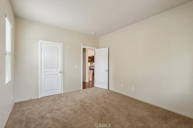 25863 Prospector Ct, Menifee, CA 92584 - unfurnished bedroom with carpet floors and baseboards