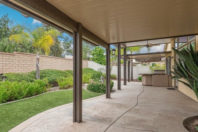 25863 Prospector Ct, Menifee, CA 92584 - fenced backyard featuring a patio area and a ceiling fan
