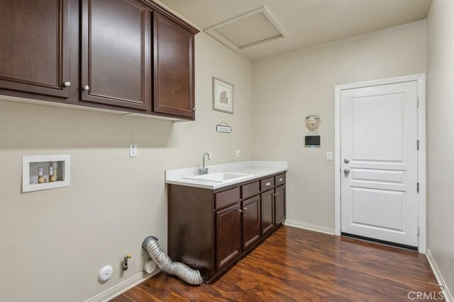 25863 Prospector Ct, Menifee, CA 92584 - washroom with gas dryer hookup, dark wood-style flooring, washer hookup, cabinet space, and baseboards