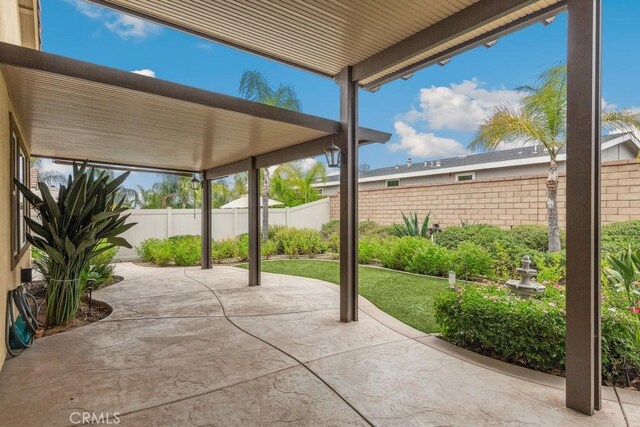 25863 Prospector Ct, Menifee, CA 92584 - fenced backyard featuring a patio area