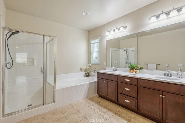 25863 Prospector Ct, Menifee, CA 92584 - bathroom featuring a bath, double vanity, tile patterned floors, and a shower stall