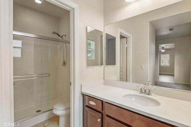 25863 Prospector Ct, Menifee, CA 92584 - full bath with a shower stall, vanity, toilet, and a ceiling fan