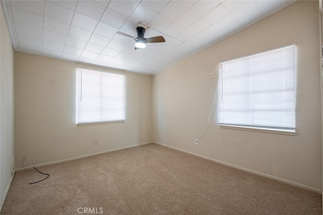 39026 11th St W, Palmdale, CA 93551 - spare room featuring plenty of natural light, carpet flooring, ceiling fan, and baseboards