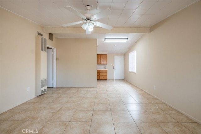 39026 11th St W, Palmdale, CA 93551 - spare room featuring a heating unit, a ceiling fan, and light tile patterned flooring