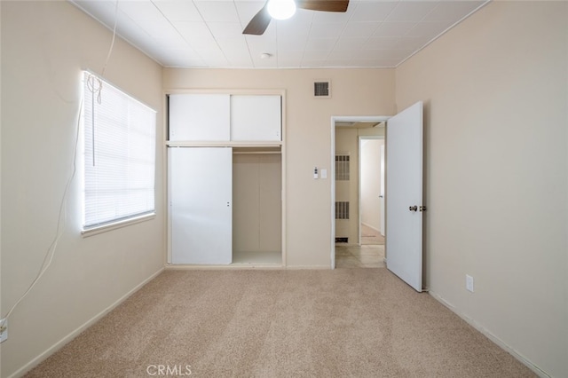 39026 11th St W, Palmdale, CA 93551 - unfurnished bedroom featuring light colored carpet, a closet, and a ceiling fan