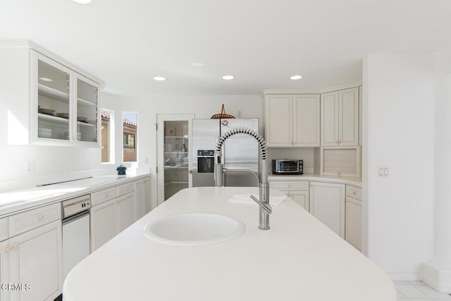5331 Wavecrest Way, Oxnard, CA 93035 - kitchen with light countertops, a sink, recessed lighting, glass insert cabinets, and white cabinets