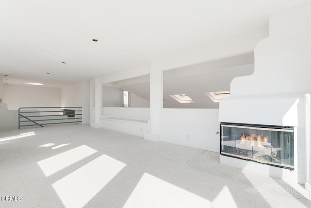 5331 Wavecrest Way, Oxnard, CA 93035 - unfurnished living room featuring carpet floors and a multi sided fireplace