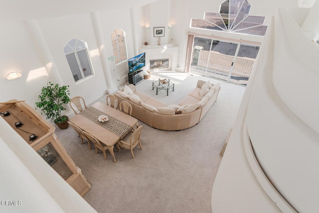 5331 Wavecrest Way, Oxnard, CA 93035 - living area with carpet flooring, a glass covered fireplace, and a towering ceiling