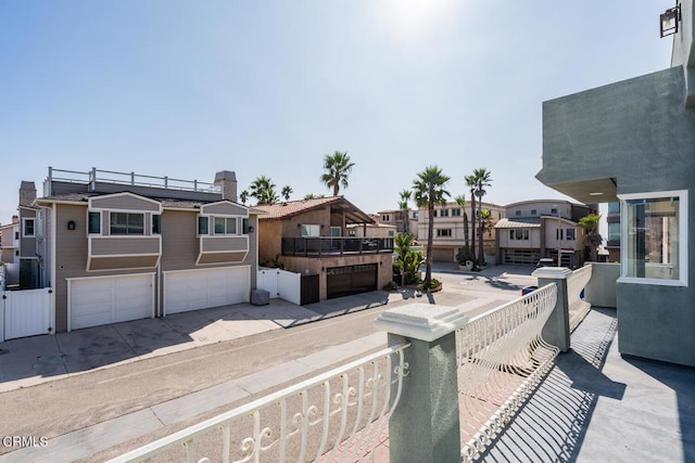 5331 Wavecrest Way, Oxnard, CA 93035 - view of patio featuring a residential view, a garage, and concrete driveway