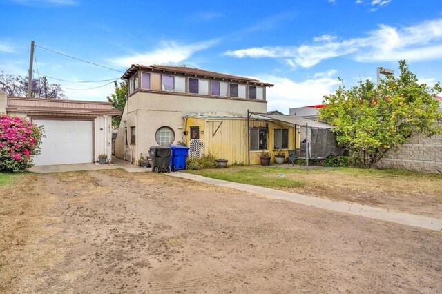 301820 Nimitz Blvd, San Diego, CA 92106 - view of front of house with dirt driveway and stucco siding