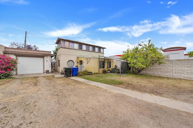 301820 Nimitz Blvd, San Diego, CA 92106 - view of front of home with dirt driveway and a garage