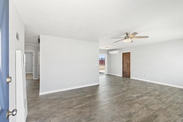 450 Dichter St, El Cajon, CA 92019 - unfurnished room with ceiling fan, an AC wall unit, dark wood finished floors, and baseboards