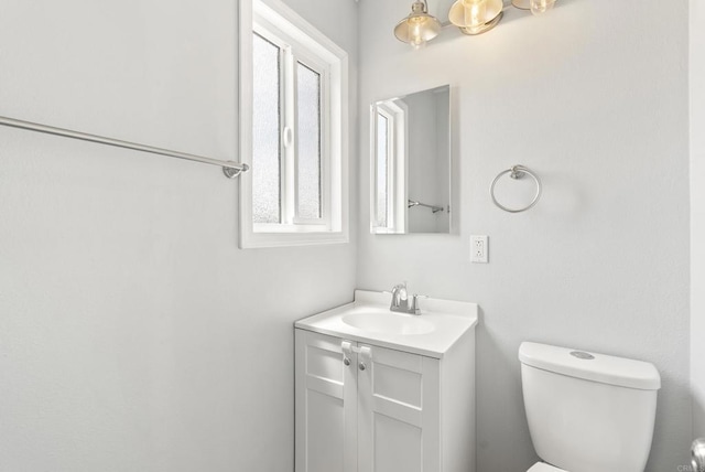 450 Dichter St, El Cajon, CA 92019 - half bathroom featuring vanity, toilet, and healthy amount of natural light