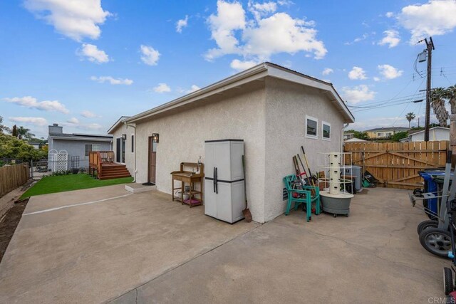 169 Theresa Way, Chula Vista, CA 91911 - rear view of property featuring a patio area, a fenced backyard, and stucco siding