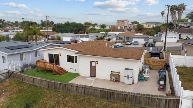 169 Theresa Way, Chula Vista, CA 91911 - back of house with a residential view, stucco siding, a wooden deck, and a shingled roof