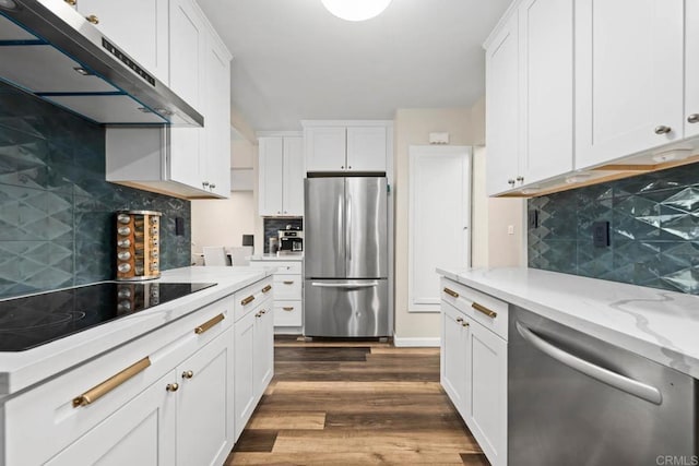 169 Theresa Way, Chula Vista, CA 91911 - kitchen with appliances with stainless steel finishes, under cabinet range hood, decorative backsplash, white cabinetry, and dark wood-style floors
