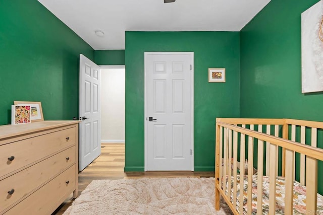 169 Theresa Way, Chula Vista, CA 91911 - bedroom featuring a crib, light wood finished floors, and baseboards