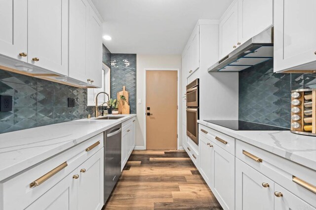169 Theresa Way, Chula Vista, CA 91911 - kitchen with a sink, under cabinet range hood, dishwasher, black electric stovetop, and white cabinets