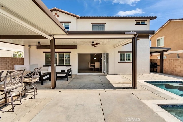15040 Capstone St, Fontana, CA 92336 - rear view of property with ceiling fan, stucco siding, outdoor lounge area, and a patio area