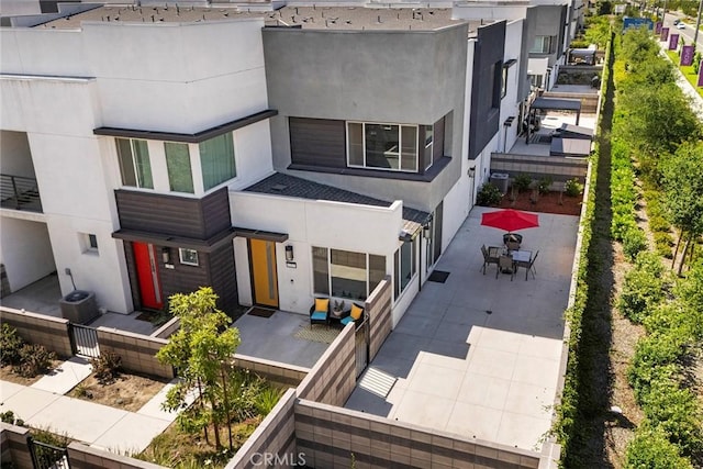 3720 S Allston Paseo Unit 7, Ontario, CA 91761 - view of front of property with stucco siding, a patio, and outdoor dining space