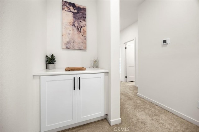 3720 S Allston Paseo Unit 7, Ontario, CA 91761 - hallway featuring light colored carpet and baseboards
