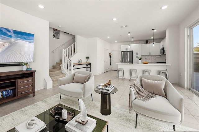 3720 S Allston Paseo Unit 7, Ontario, CA 91761 - living area featuring stairway, recessed lighting, light tile patterned floors, and baseboards