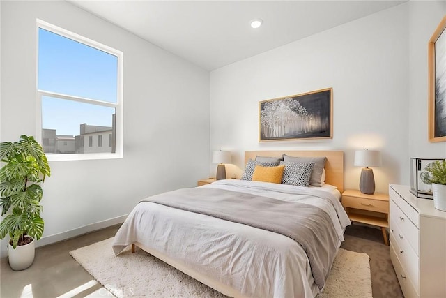 3720 S Allston Paseo Unit 7, Ontario, CA 91761 - bedroom with baseboards, recessed lighting, and concrete flooring