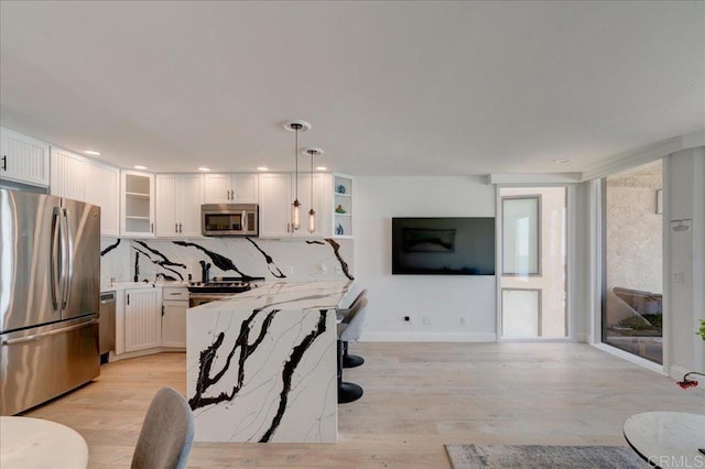 190 Del Mar Shores Ter Unit 24, Solana Beach, CA 92075 - living area featuring light wood-style floors, recessed lighting, and baseboards