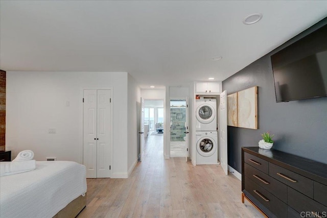 190 Del Mar Shores Ter Unit 24, Solana Beach, CA 92075 - bedroom with estacked washer and dryer, light wood-type flooring, baseboards, recessed lighting, and a closet