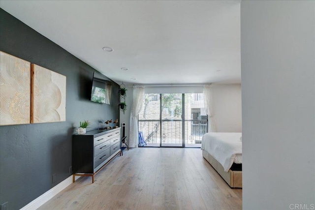 190 Del Mar Shores Ter Unit 24, Solana Beach, CA 92075 - bedroom featuring light wood-style flooring and baseboards