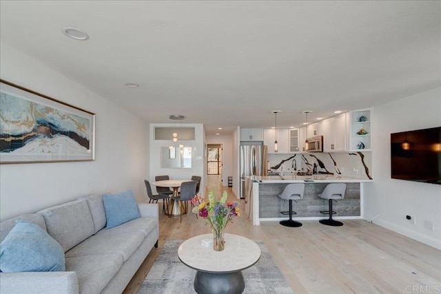 190 Del Mar Shores Ter Unit 24, Solana Beach, CA 92075 - living room featuring light wood-style flooring, recessed lighting, and baseboards