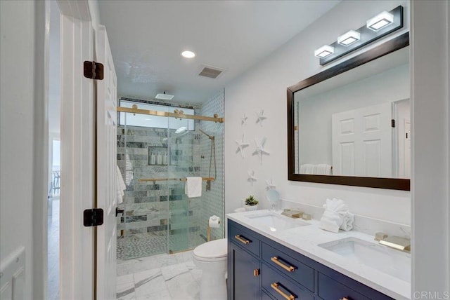 190 Del Mar Shores Ter Unit 24, Solana Beach, CA 92075 - bathroom featuring double vanity, a shower stall, toilet, and marble look tile flooring