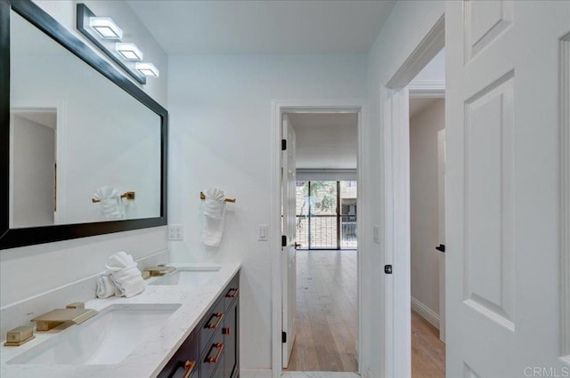 190 Del Mar Shores Ter Unit 24, Solana Beach, CA 92075 - bathroom featuring double vanity and wood finished floors