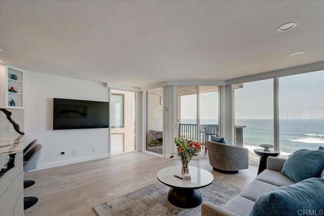 190 Del Mar Shores Ter Unit 24, Solana Beach, CA 92075 - living room with plenty of natural light, light wood-type flooring, and baseboards