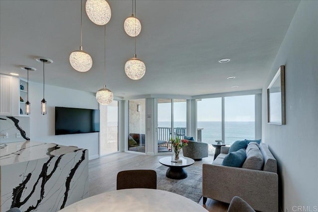 190 Del Mar Shores Ter Unit 24, Solana Beach, CA 92075 - living room featuring wood finished floors and expansive windows