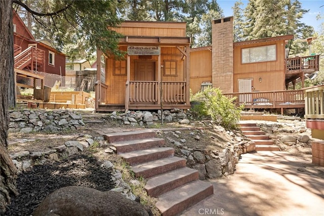 26249 Cedar Ln, Twin Peaks, CA 92391 - rear view of property featuring stairs, a chimney, and a deck