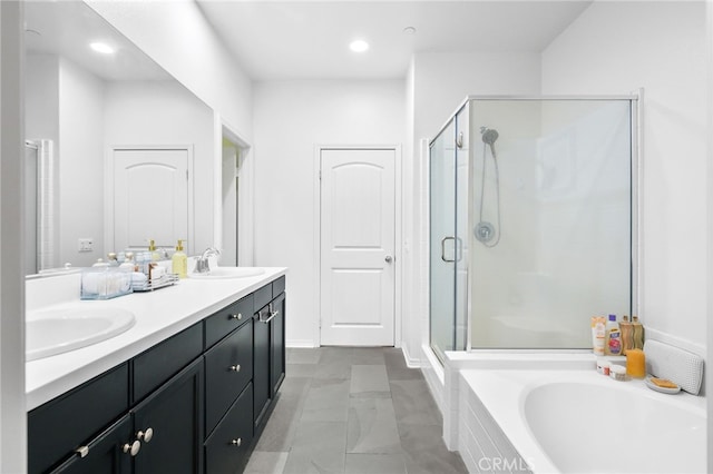 22124 Barrington Way, Saugus, CA 91350 - full bath featuring a shower stall, a garden tub, double vanity, marble look tile flooring, and recessed lighting