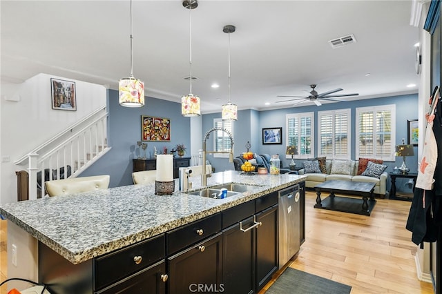 22124 Barrington Way, Saugus, CA 91350 - kitchen with a sink, stainless steel dishwasher, an island with sink, light wood-style flooring, and recessed lighting