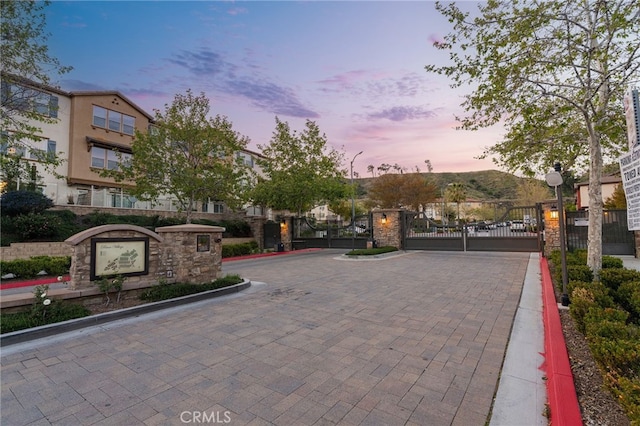 22124 Barrington Way, Saugus, CA 91350 - view of road with a gate, curbs, and street lighting