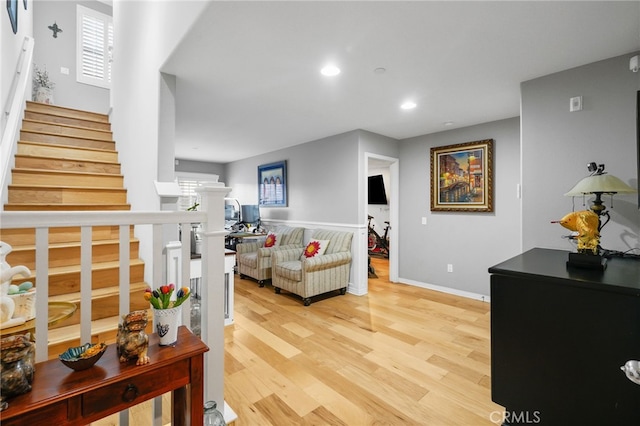 22124 Barrington Way, Saugus, CA 91350 - living area featuring light wood-style flooring, stairway, recessed lighting, and baseboards