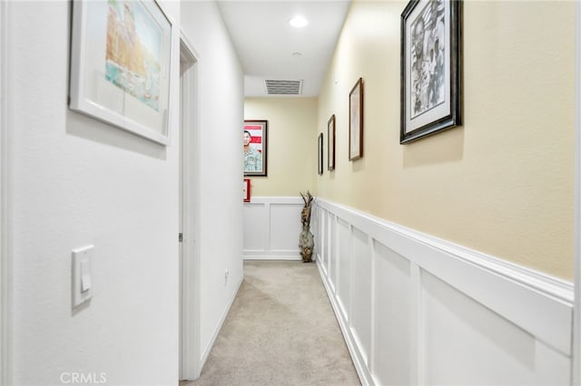 22124 Barrington Way, Saugus, CA 91350 - hallway with a wainscoted wall, light carpet, and a decorative wall