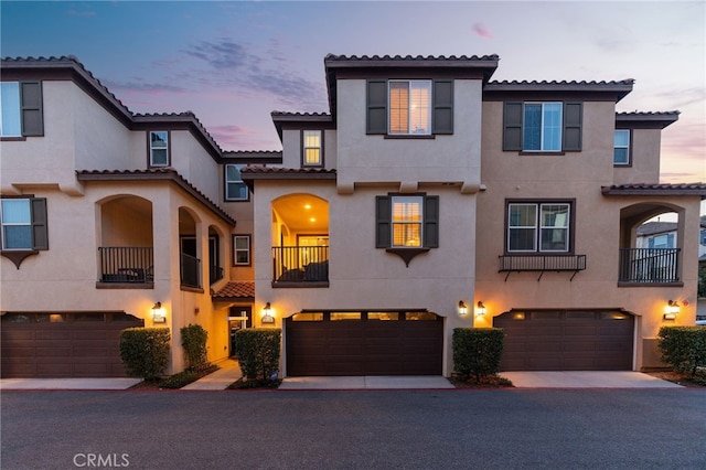 22124 Barrington Way, Saugus, CA 91350 - view of front of home with stucco siding, a tile roof, and an attached garage