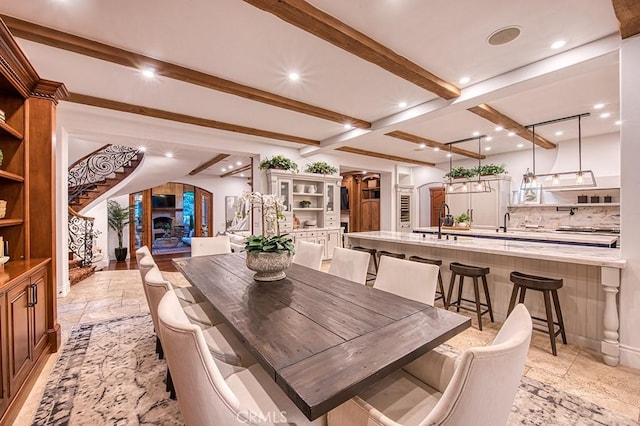 31742 Contijo Way, Coto De Caza, CA 92679 - dining space with arched walkways, beamed ceiling, and recessed lighting