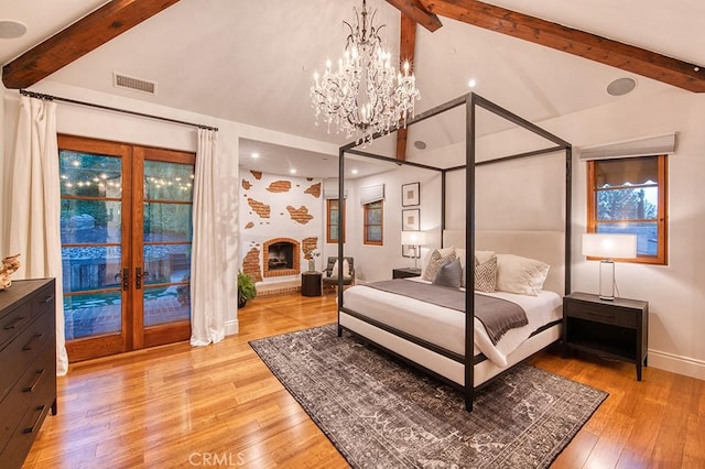31742 Contijo Way, Coto De Caza, CA 92679 - bedroom featuring french doors, a chandelier, light wood-type flooring, access to outside, and multiple windows