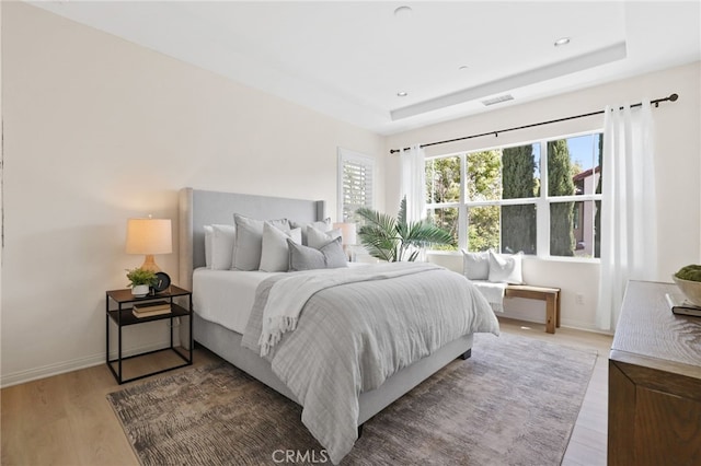 84 Plum Feather, Irvine, CA 92620 - bedroom with light wood-style flooring, baseboards, a raised ceiling, and recessed lighting