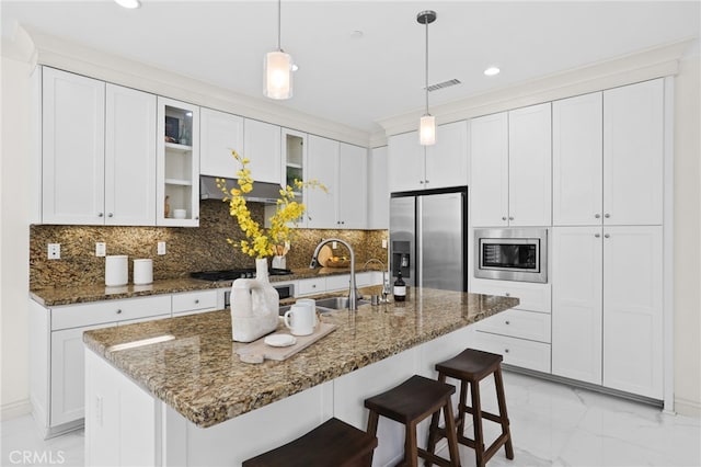 84 Plum Feather, Irvine, CA 92620 - kitchen with appliances with stainless steel finishes, light marble finish flooring, glass insert cabinets, white cabinets, and recessed lighting