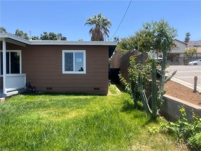 12055 Mount Vernon Ave, Grand Terrace, CA 92313 - view of home's exterior featuring crawl space and a yard